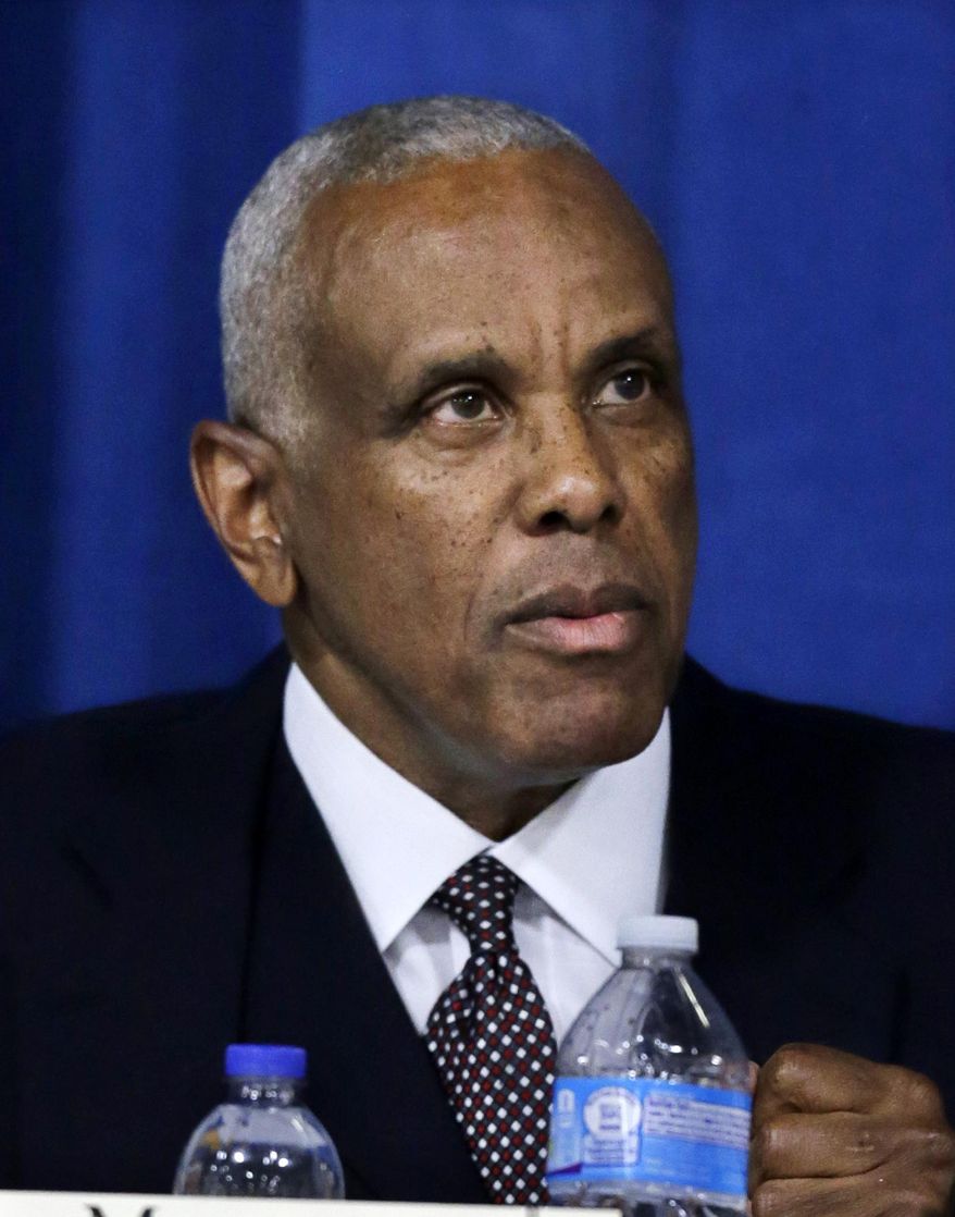 In a Tuesday, May 13, 2014 photo, Logan Township, N.J., Mayor Frank Minor participates in a debate in Lawnside, N.J., with other candidates for the 1st Congressional District seat covering Burlington, Camden and Gloucester counties. In the Democratic primary June 3, Minor will face New Jersey state Sen. Donald Norcross and graduate student Frank Broomell. (AP Photo/Mel Evans)