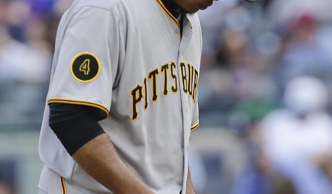 Pittsburgh Pirates starting pitcher Edinson Volquez reacts after giving up a two-run home run to New York Yankees&#x27; Mark Teixeira during the first inning of a baseball game, Saturday, May 17, 2014, in New York. (AP Photo/Julie Jacobson)