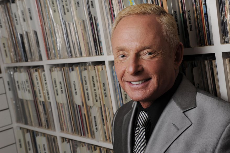 In this Tuesday, April 29, 2014 photo, Elliot Mintz poses for a portrait in his library at his home in Beverly Hills, Calif. Determined to retire after five decades in Hollywood, the 69-year-old is releasing what he calls a “cyberography”: A free website filled with more than 150 hours of his radio and TV interviews comprising hundreds of celebrities and subjects. ElliotMintz.com goes live Sunday, May 18, 2014. (Photo by Chris Pizzello/Invision/AP)