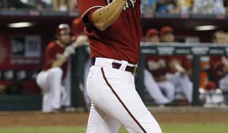 Arizona Diamondbacks&#x27; Eric Chavez connects on a 2-run home run against the Los Angeles Dodgers during the fifth inning of a baseball game on Sunday, May 18, 2014, in Phoenix. (AP Photo/Ross D. Franklin)