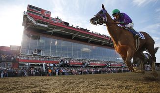 California Chrome, ridden by jockey Victor Espinoza, wins the 139th Preakness Stakes horse race at Pimlico Race Course, Saturday, May 17, 2014, in Baltimore.  (AP Photo/Matt Slocum)