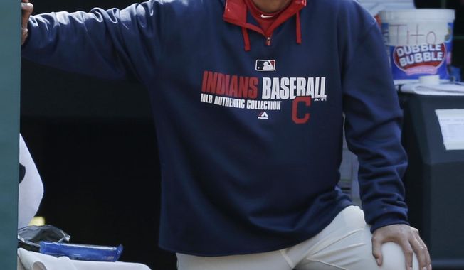 Cleveland Indians manager Terry Francona watches in the eighth inning of a baseball game against the Oakland Athletics, Sunday, May 18, 2014, in Cleveland. (AP Photo/Tony Dejak)