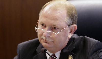 FILE - In this July 2, 2013 file photo, Alabama Public Service Commissioner Terry Dunn listens to a debate during a commission meeting in Montgomery, Ala. Dunn faces three opponents in the June 3, 2014 Republican primary. (AP Photo/Dave Martin)