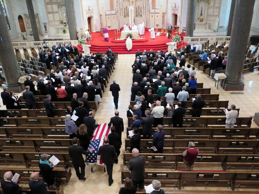 Pallbearers escort casket of former Wisconsin Gov. Patrick Lucey into the Church of Gesu for funeral services Monday, May 19, 2014 in Milwaukee. Lucey was a hard-nosed Democrat who died May 10, 2014 at age 96. He was Wisconsin's governor from 1970 to 1977. (AP Photo/Carrie Antlfinger)