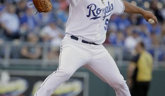 Kansas City Royals starting pitcher Jason Vargas throws during the first inning of a baseball game against the Chicago White Sox on Monday, May 19, 2014, in Kansas City, Mo. (AP Photo/Charlie Riedel)