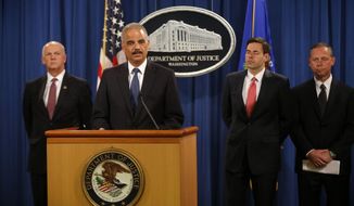 Attorney General Eric Holder, accompanied by, from left, U.S. Attorney for Western District of Pennsylvania David Hickton,  Assistant Attorney General for National Security John Carlin, and FBI Executive Associate Director Robert Anderson, speaks at a news conference at the Justice Department in Washington, Monday, May 19, 2014. Holder was announcing that a U.S. grand jury has charged five Chinese hackers with economic espionage and trade secret theft, the first-of-its-kind criminal charges against Chinese military officials in an international cyber-espionage case. (AP Photo/Charles Dharapak)