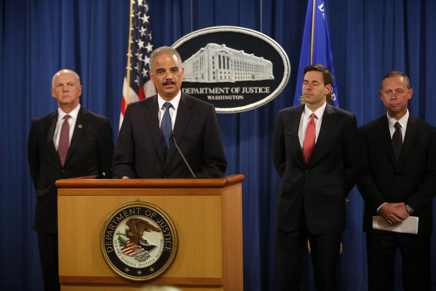 Attorney General Eric Holder, accompanied by, from left, U.S. Attorney for Western District of Pennsylvania David Hickton, Assistant Attorney General for National Security John Carlin, and FBI Executive Associate Director Robert Anderson, speaks at a news conference at the Justice Department in Washington, Monday, May 19, 2014. Holder was announcing that a U.S. grand jury has charged five Chinese hackers with economic espionage and trade secret theft, the first-of-its-kind criminal charges against Chinese military officials in an international cyber-espionage case. (AP Photo/Charles Dharapak)