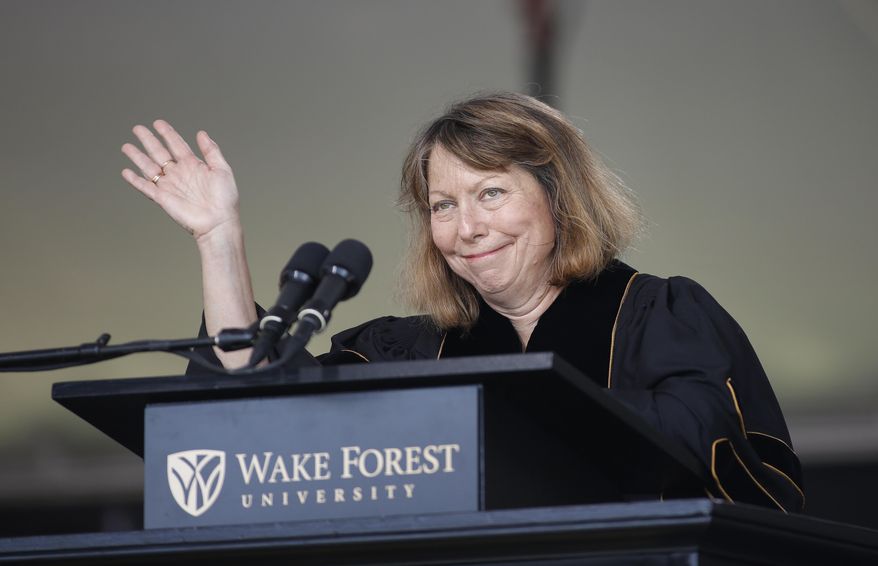 Jill Abramson, former executive editor of The New York Times, waves as she speaks at the commencement ceremony at Wake Forest University in Winston-Salem, N.C., Monday, May 19, 2014. (AP Photo/Nell Redmond)