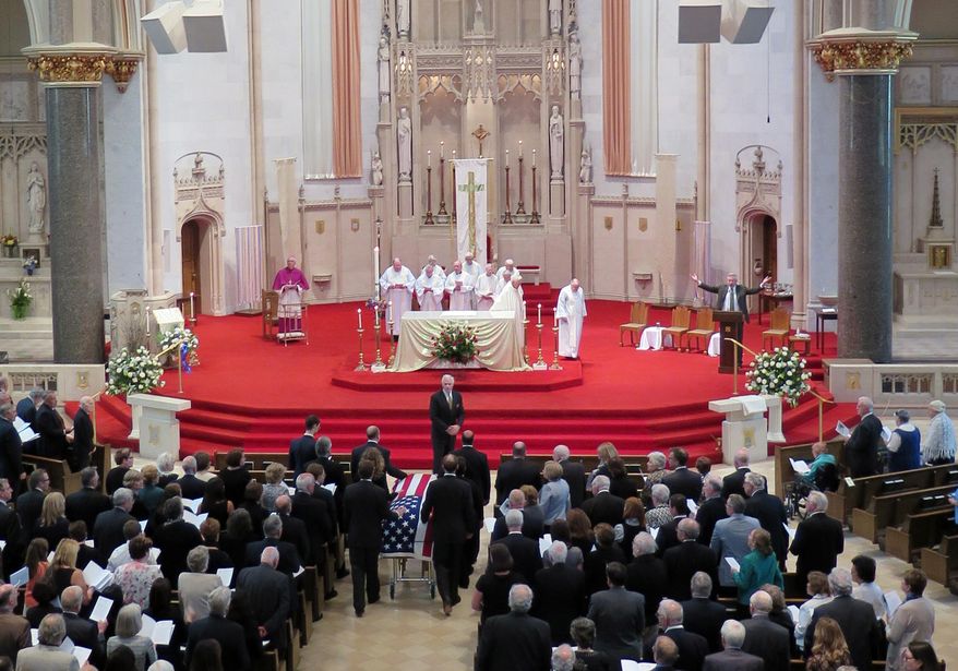 Pallbearers escort casket of former Wisconsin Gov. Patrick Lucey into the Church of Gesu for funeral services Monday, May 19, 2014 in Milwaukee. Lucey was a hard-nosed Democrat who died May 10, 2014 at age 96. He was Wisconsin's governor from 1970 to 1977. (AP Photo/Carrie Antlfinger)