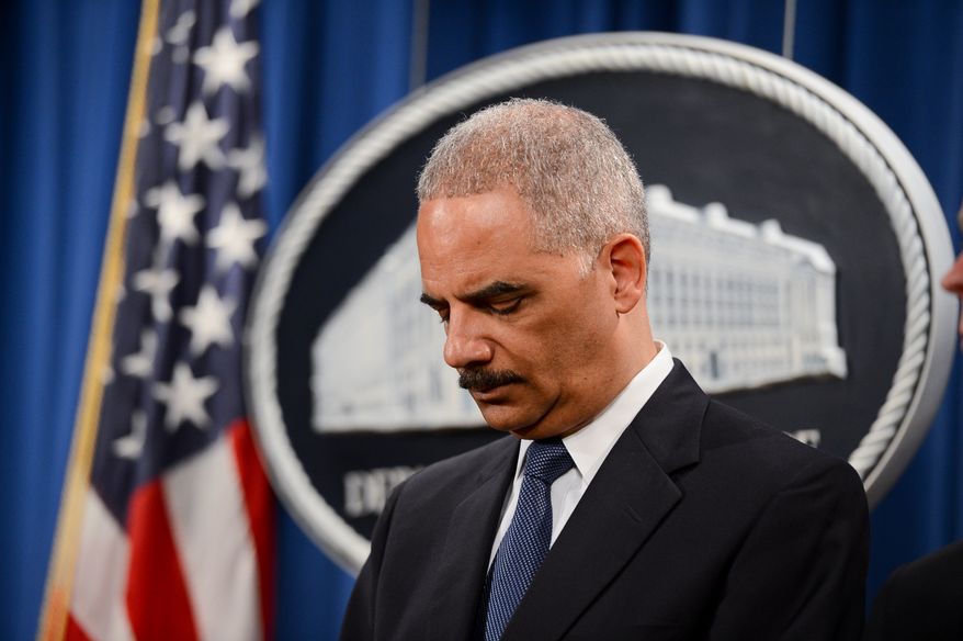 Attourney General Eric Holder announces a criminal indictment against five Chinese military hackers for cyber espionage at a press conference at the Department of Justice, Washington, D.C., Monday, May 19, 2014. The five hackers are identified as Wen Xinyu, Wang Dong, Sun Kailiang, Huang Zhenyu, and Gu Chunhui and are charged with targeting U.S. corporations and labor organizations for commercial advantage. (Andrew Harnik/The Washington Times)