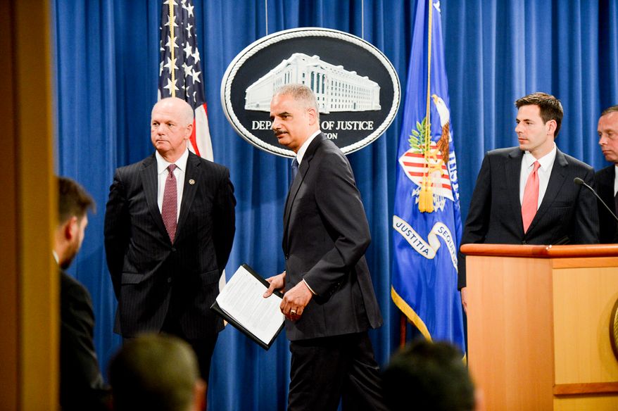 Attourney General Eric Holder leaves after announcing a criminal indictment against five Chinese military hackers for cyber espionage at a press conference at the Department of Justice, Washington, D.C., Monday, May 19, 2014. The five hackers are identified as Wen Xinyu, Wang Dong, Sun Kailiang, Huang Zhenyu, and Gu Chunhui and are charged with targeting U.S. corporations and labor organizations for commercial advantage. Also pictured are Assistant Attorney General for National Security John Carlin, right, and U.S. Attorney for Western District of Pennsylvania David Hickton, left. (Andrew Harnik/The Washington Times)