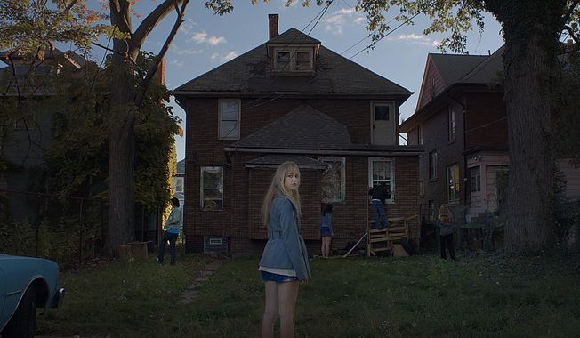 In this image released by Brigade Marketing, actress Maika Monroe appears in a scene of It Follows, directed by David Robert Mitchell. “It Follows,” has been arguably the buzziest American film at Cannes next to Bennett Miller’s wrestling drama “Foxcatcher,” which boasts a far more famous cast and a major premiere at the Palais des Festival. (AP Photo/Michael Gioulakis via Brigade Marketing)