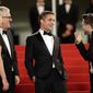 From left, producer Liz Watts, producer David Linde, actor Robert Pattinson, director David Michod, and actor Guy Pearce laugh as they pose for photographers as they arrive for the screening of The Rover at the 67th international film festival, Cannes, southern France, Sunday, May 18, 2014. (AP Photo/Thibault Camus)