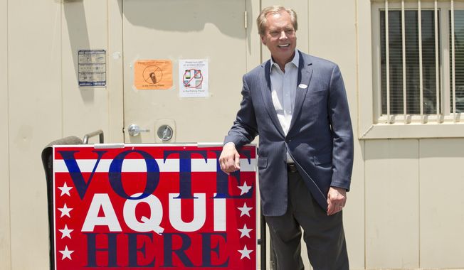 Lt. Gov. David Dewhurst smiles after voting in the runoff election for Lt. Governor in Austin, Texas, on Monday, May 19, 2014. (AP Photo/Austin American-Statesman, Jay Janner)