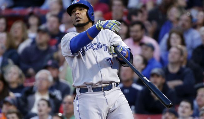 Toronto Blue Jays&#x27; Edwin Encarnacion watches his two-run homer in the third inning of a baseball game against the Boston Red Sox at Fenway Park in Boston, Tuesday, May 20, 2014. (AP Photo/Elise Amendola)