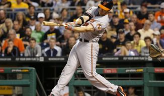 Baltimore Orioles&#39; Chris Davis hits a two-run home run off Pittsburgh Pirates starting pitcher Francisco Liriano during the fifth inning of a baseball game in Pittsburgh on Tuesday, May 20, 2014. (AP Photo/Gene J. Puskar)