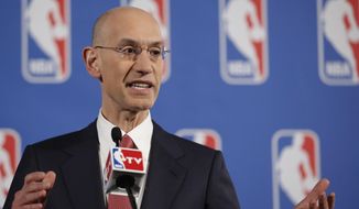 NBA Commissioner Adam Silver gestures as he answers reporters&#x27; questions during a news conference before the NBA draft lottery in New York, Tuesday, May 20, 2014.  (AP Photo/Kathy Willens)