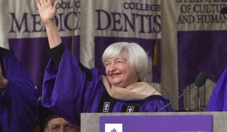 Federal Reserve Chair Janet Yellen waves to the crowd at New York University&#39;s commencement ceremony Wednesday, May 21, 2014, at Yankee Stadium in New York.  (AP Photo/Frank Franklin II)