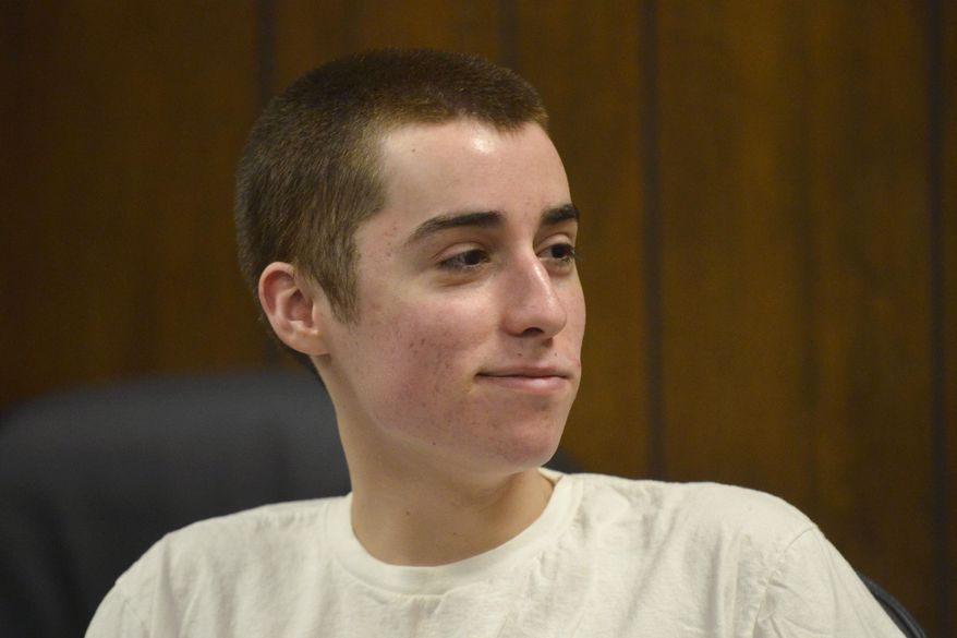 FILE - In this March 19, 2013 file photo, T.J. Lane smirks as he listens to the judge during his sentencing in Chardon, Ohio. Lane received three life sentences without the possibility of parole for killing three students at Chardon High School in 2012. The families of the three students killed will receive settlements of about $890,000 each from a lawsuit filed against the shooter's family. (AP Photo/The News-Herald, Duncan Scott, Pool, File)