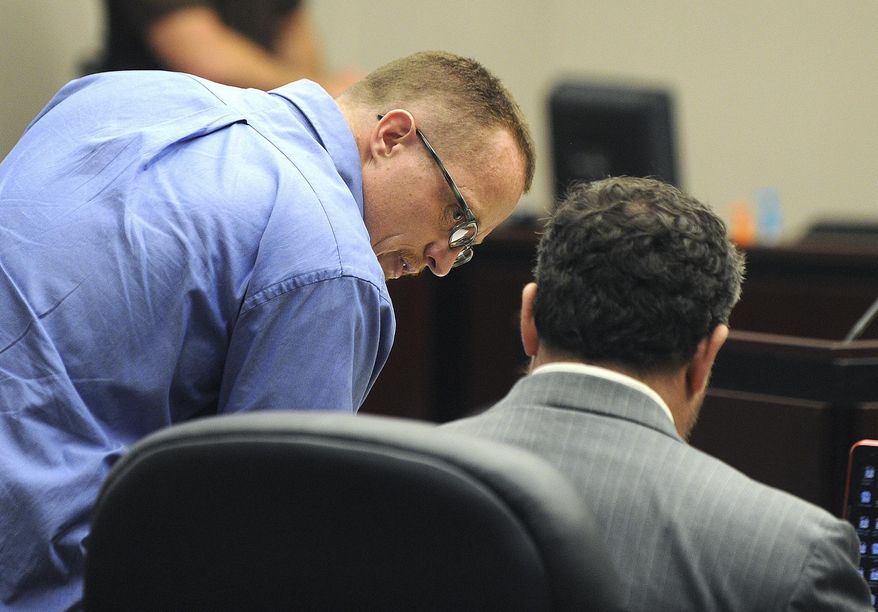 Nicholas Sheley, left, talks with his attorney, Jeremy Karlin, during the third day of his trial at the Rock Island County Justice Center on Wednesday, May 21, 2014, in Rock Island, Ill. Sheley is on trial for the June 2008 deaths of Brock Branson, 29, Kilynna Blake, 20, her 2-year-old son, Dayan, and Kenneth Ulve, 25, in Rock Falls. (AP Photo/The Dispatch, Paul Colletti, Pool)