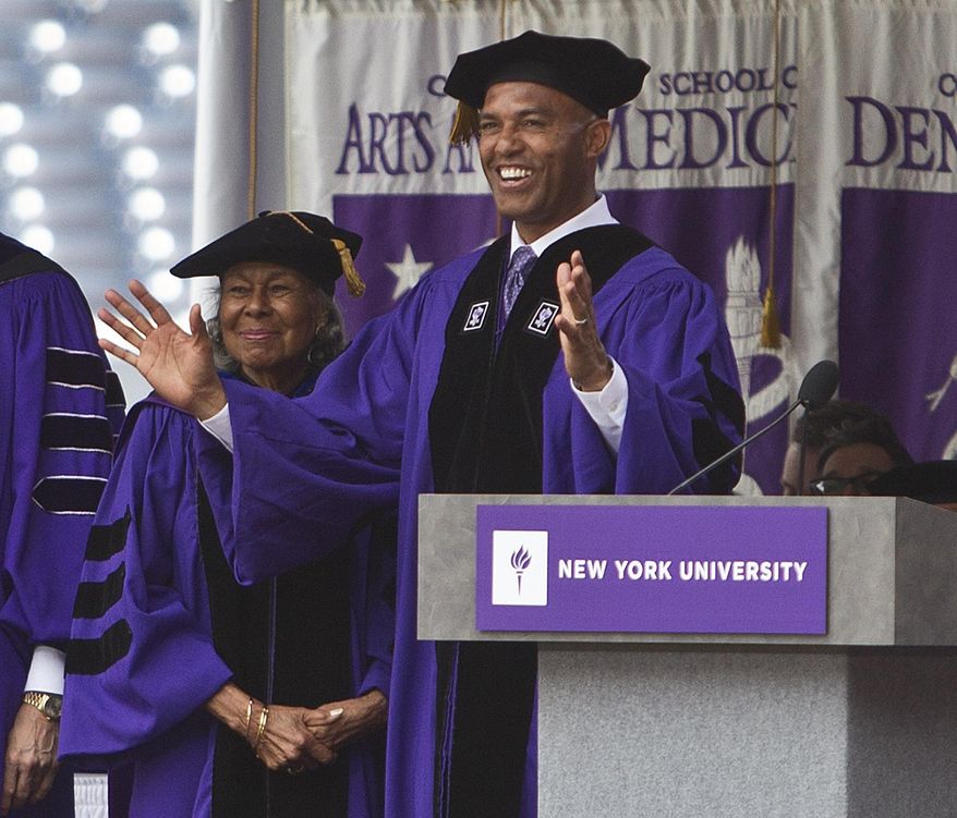 Former New York Yankees pitcher Mariano Rivera, right, and Mrs Rachel Robinson, widow of Jackie Robinson, left, take part in a New York University graduation ceremony Wednesday, May 21, 2014, at Yankee Stadium in New York.  (AP Photo/Frank Franklin II)