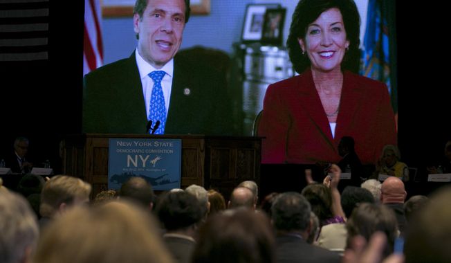 Gov. Andrew Cuomo appears via video with former Congresswoman Kathy Hochul of Buffalo, NY, as his choice to be New York&#x27;s next lieutenant governor, during the opening session of the state&#x27;s Democratic Convention, in Melville, N.Y., Wednesday, May 21, 2014. (AP Photo/Richard Drew)