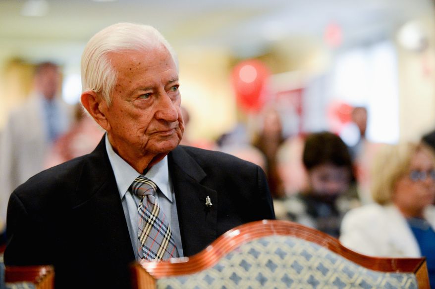 Rep. Ralph Hall, Texas Republican, is one of the last World War II vets serving in Congress. He spoke at a Memorial Day tribute to veterans and veterans in Congress held by the Washington Times at the Capitol Hill Club in the District on Wednesday. (Andrew Harnik/The Washington Times)