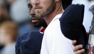 Newly signed Boston Red Sox player Stephen Drew stands with teammates for the national anthem prior to a baseball game against the Toronto Blue Jays at Fenway Park in Boston, Wednesday, May 21, 2014. (AP Photo/Elise Amendola)