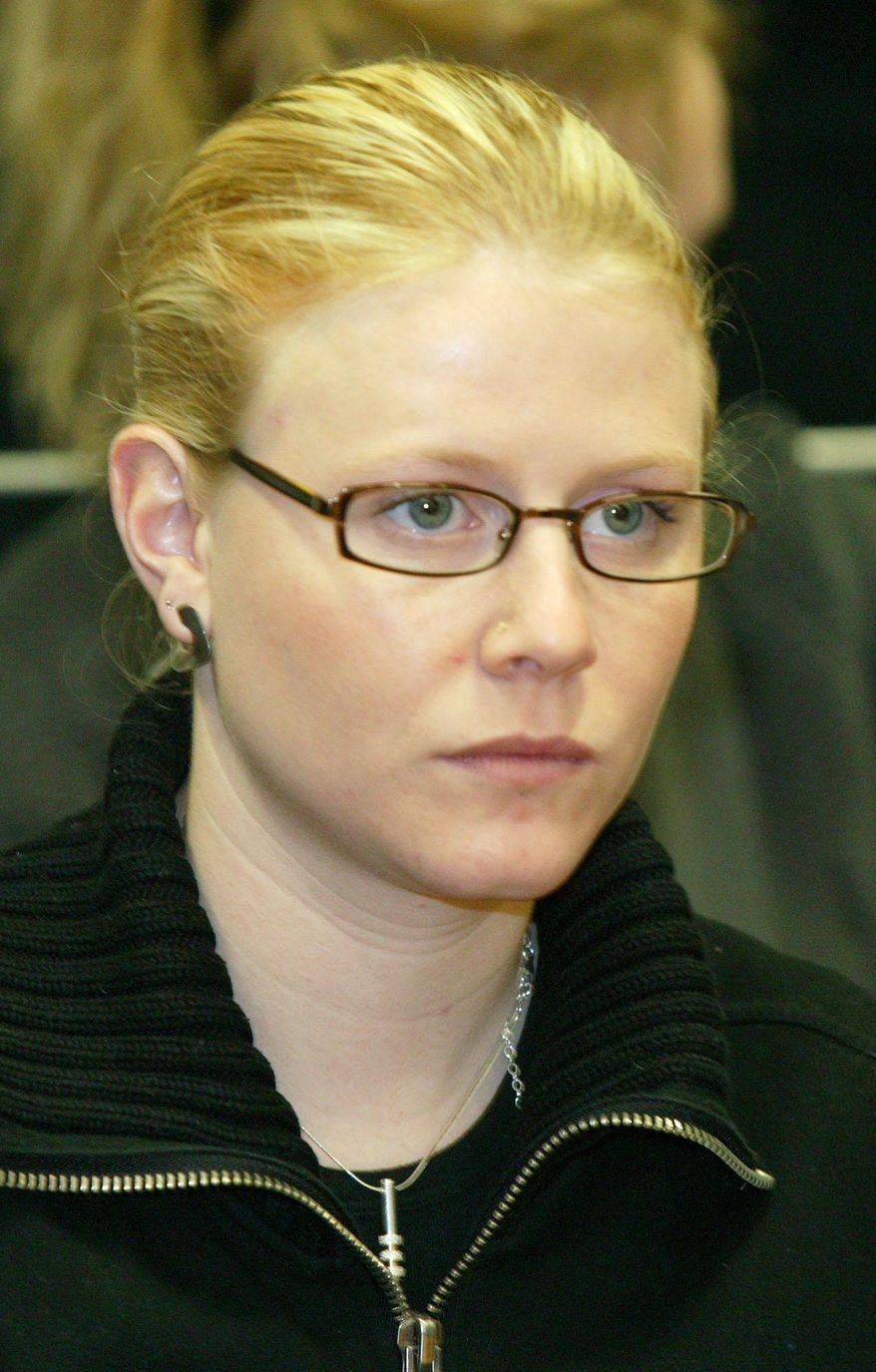 File-This March 10, 2004, file photo shows Laetitia Delhez attending the hearing at the Palace of Justice in Arlon, Belgium. Girls between the ages of 8 and 19 when snatched between mid-1995 and August 1996, the six victims were abducted, tortured and abused by Belgian Marc Dutroux. Only Sabine Dardenne, 12, and Delhez, 14, escaped alive after being found near the southern Belgian town of Charleroi a few days after Dutroux's arrest in August 1996. He is serving a life sentence. His wife, Michelle Martin, is now in a convent after serving 16 years of a 30-year prison term. (AP Photo/Jean-Michel Clajot, Pool,File)