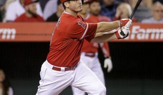 Los Angeles Angels&#x27; David Freese watches his RBI-double against the Houston Astros during the sixth inning of a baseball game in Anaheim, Calif., Tuesday, May 20, 2014. (AP Photo/Chris Carlson)