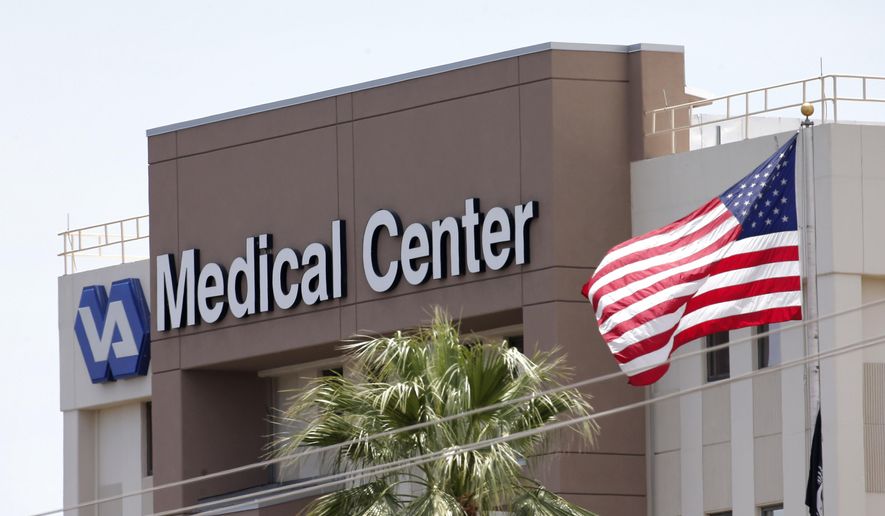 This photo from Saturday, May 17, 2014 shows the Department of Veterans Affairs in Phoenix. The Veterans Affairs Inspector General&#39;s office said late Tuesday, May 20, 2014, that 26 facilities are being investigated nationwide — up from 10 just last week — including a hospital in Phoenix, Arizona, where 40 veterans allegedly died while waiting for treatment and staff there kept a secret list of patients waiting for appointments to hide delays in care. (AP Photo/Matt York)