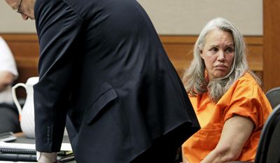Pamela Phillips looks to the  gallery in Pima County Superior Court in Tucson, Ariz., Thursday, May 22, 2014 as defense attorney Paul Eckerstrom reads letters of support for her prior to her being sentenced to natural life in prison without the possibility of parole in the 1996 Tucson car bomb killing of her ex-husband. Phillips also was sentenced Thursday to 25 years to life for conspiracy to commit first-degree murder. (AP Photo/Arizona Daily Star, Ron Medvescek)