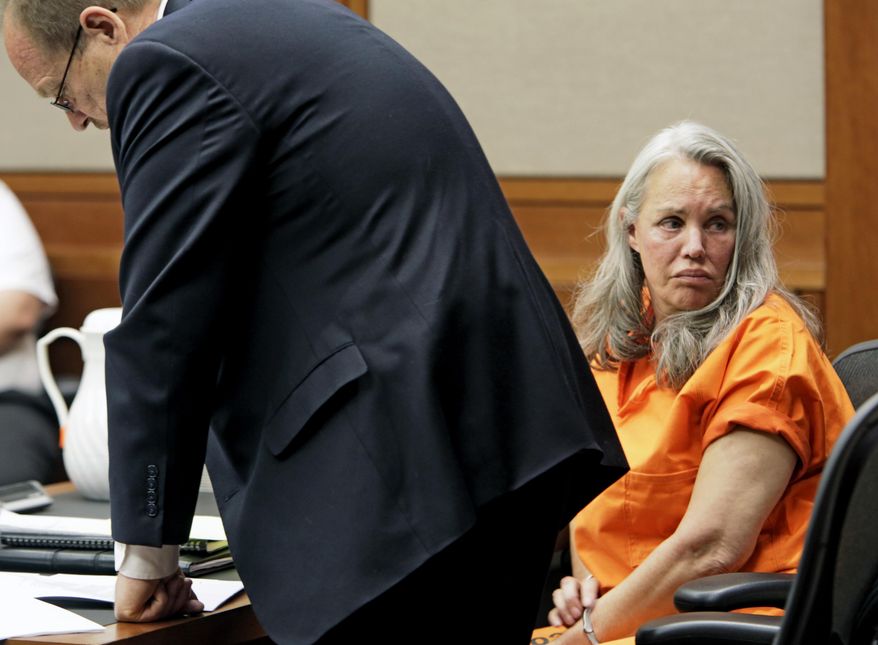 Pamela Phillips looks to the gallery in Pima County Superior Court in Tucson, Ariz., Thursday, May 22, 2014 as defense attorney Paul Eckerstrom reads letters of support for her prior to her being sentenced to natural life in prison without the possibility of parole in the 1996 Tucson car bomb killing of her ex-husband. Phillips also was sentenced Thursday to 25 years to life for conspiracy to commit first-degree murder. (AP Photo/Arizona Daily Star, Ron Medvescek)
