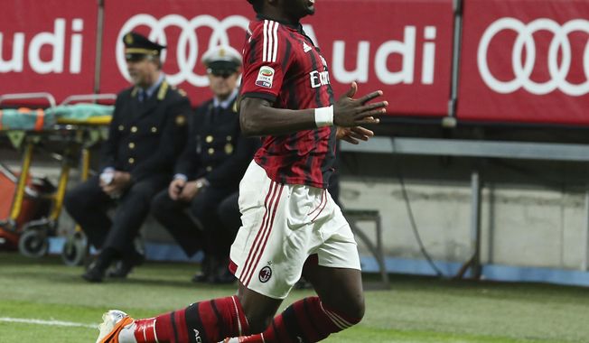 AC Milan midfielder Sulley Muntari, of Ghana, celebrates after scoring during the Serie A soccer match between AC Milan and Sassuolo at the San Siro stadium in Milan, Italy, Sunday, May 18, 2014. (AP Photo/Antonio Calanni)