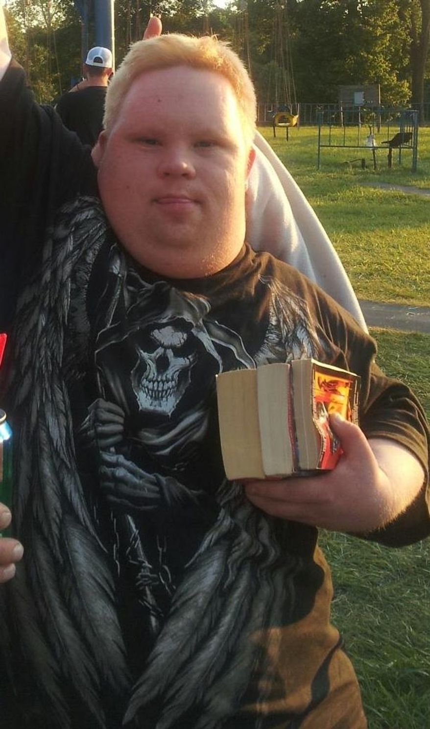 FILE - This undated family photo shows Robert Ethan Saylor, who died of of asphyxiation Jan. 12, 2013, during a struggle with three off-duty Frederick County, Md., sheriff’s deputies. A Maryland commission formed in response to the death in custody of Saylor plans to make people with intellectual and developmental disabilities the teachers in a mandatory, statewide police training program. (AP Photo/Courtesy Patti Saylor, File)