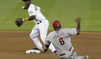 Philadelphia Phillies&#39; Ryan Howard (6) is forced out at second base as Miami Marlins shortstop Adeiny Hechavarria prepares to thow to first base in the inning of a baseball game in Miami, Thursday, May 22, 2014. (AP Photo/Alan Diaz)
