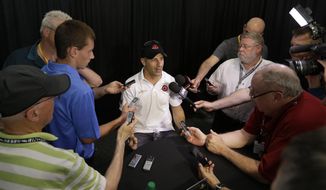 Tony Kanaan, of Brazil, responds to a question during a media interview for the Indianapolis 500 IndyCar auto race at the Indianapolis Motor Speedway in Indianapolis, Thursday, May 22, 2014. (AP Photo/Darron Cummings)