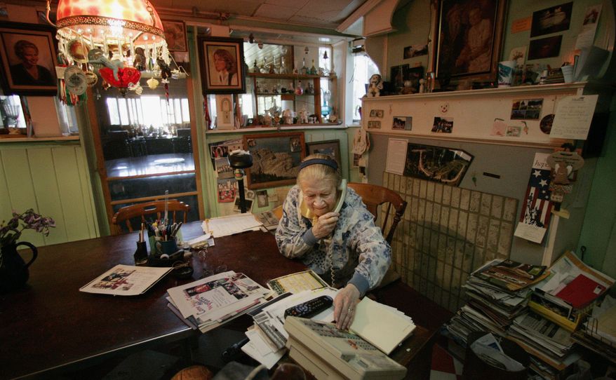 FILE - In this June 14, 2006 file photo, Ruth Ziolkowski, widow of sculptor Korczak Ziolkowski who began carving the likeness of Sioux warrior Crazy Horse into a granite mountain in 1948, conducts business on the ongoing project at her dining room table at Crazy Horse Memorial in the Black Hills near Custer, S.D. Ziolkowski, who took over the dream of her husband, upon his death in 1982 and turned it into a multimillion-dollar operation that draws more than a million visitors a year, died Wednesday, May 21, 2014 at age 87. (AP Photo/M. Spencer Green, File)