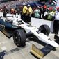 Ed Carpenter pulls in after winning the pole during qualifications for the Indianapolis 500 IndyCar auto race at the Indianapolis Motor Speedway in Indianapolis, Sunday, May 18, 2014. (AP Photo/Michael Conroy)