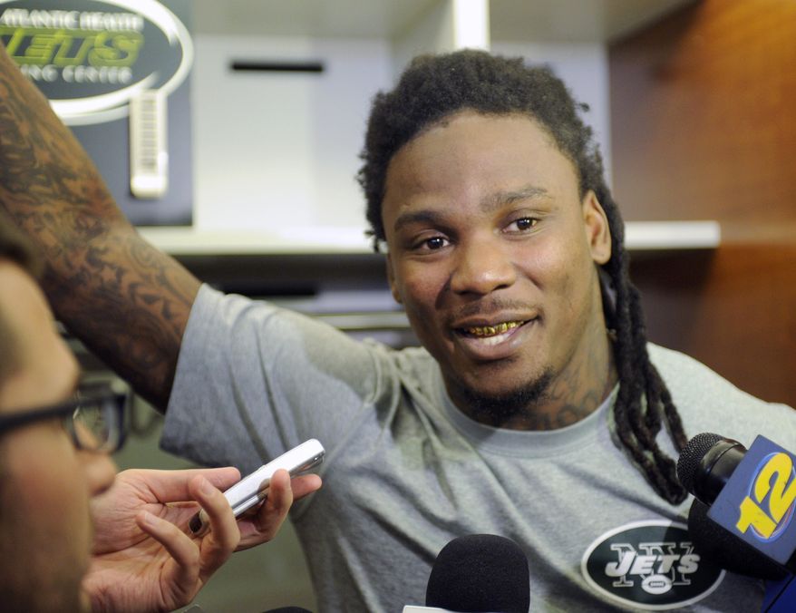 New York Jets NFL football running back Chris Johnson speaks to the media Thursday, May 22, 2014, in Florham Park, N.J. (AP Photo/Bill Kostroun)