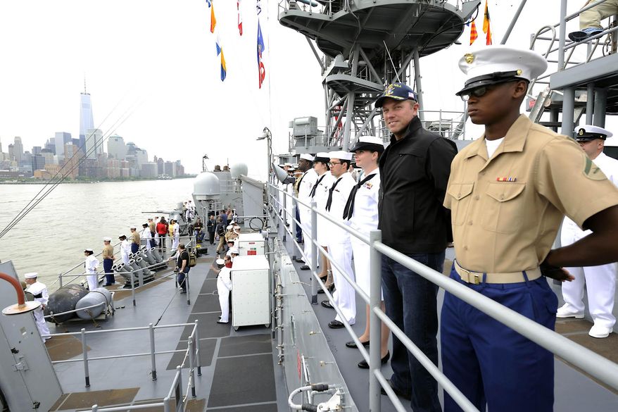 This photo released by TNT shows actor Adam Baldwin, second right, from the new TNT series "The Last Ship," standing on deck with U.S. Marine and Navy personnel from the USS Oak Hill as it arrives in New York for Fleet Week on Wednesday, May 21, 2014. On Tuesday, Baldwin hosted a special screening aboard the dock landing ship. The series, also starring Eric Dane and Rhona Mitra, premieres on Sunday, June 22, at 9 p.m. ET (AP Photo/TNT, E. M. Pio Roda)