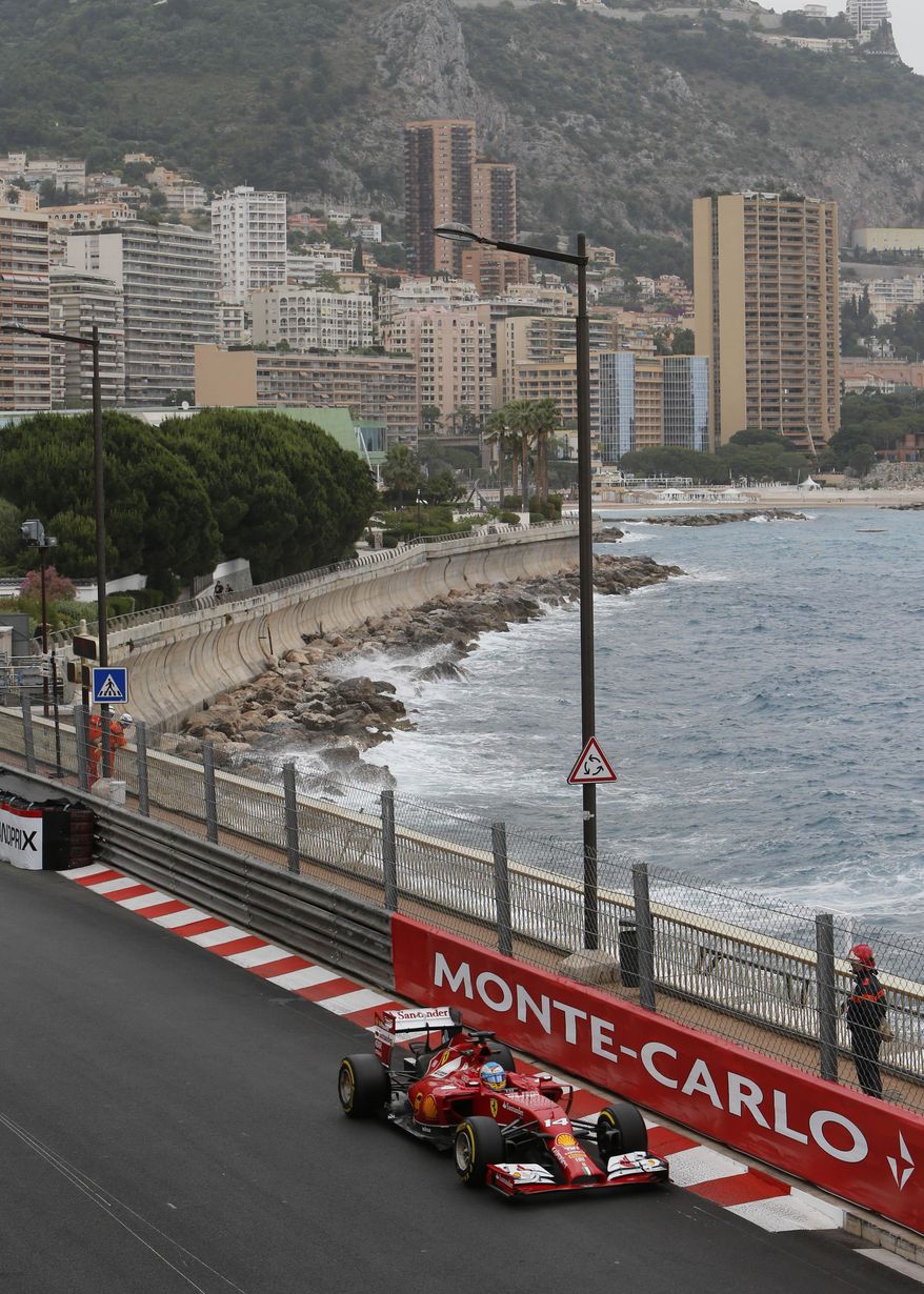 Ferrari driver Fernando Alonso of Spain steers his car during the first free practice at the Monaco racetrack, in Monaco, Thursday, May 22, 2013. The Monaco Formula One Grand Prix will be held on Sunday. (AP Photo/Claude Paris)