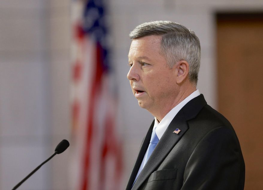 FILE - In this Jan. 15, 2014 file photo, Nebraska Gov. Dave Heineman delivers the annual State of the State address in Lincoln, Neb. Gov. Heineman said on Thursday, May 22 2014, that he hasn't applied for the University of Nebraska presidency, but he expects to make a decision in the next few weeks. The Republican governor acknowledged on his radio call-in show that he was looking seriously at the job, which became open with President J.B. Milliken's departure to become chancellor at the City University of New York. (AP Photo/Nati Harnik, File)