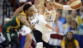 Connecticut Sun’s Katie Douglas, right, steals the ball from Seattle Storm’s Temeka Johnson during the first half of a WNBA basketball game, Friday, May 23, 2014, in Uncasville, Conn. (AP Photo/Jessica Hill)