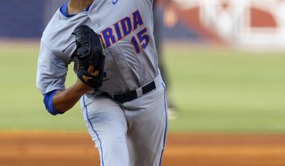 Florida&#x27;s Danny Young pitches against Mississippi State during the first inning at the Southeastern Conference NCAA college baseball tournament Friday, May 23, 2014, in Hoover, Ala. (AP Photo/Butch Dill)
