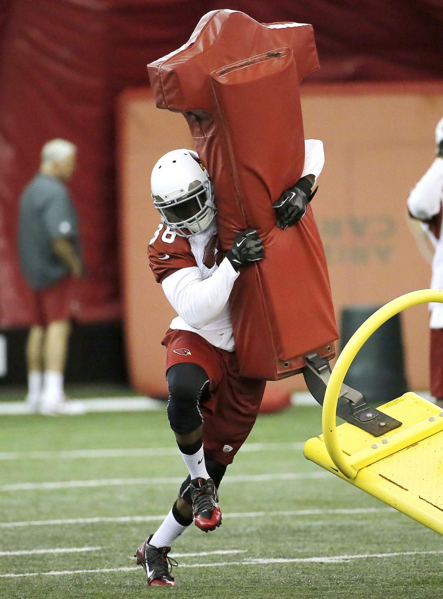 Arizona Cardinals first-round draft pick Deone Bucannon participates in team workouts during an NFL rookie football mini camp, Friday, May 23, 2014, in Tempe, Ariz. (AP Photo/Matt York)