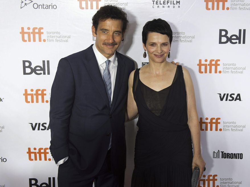 In this Sept. 7, 2013 file photo, actors Clive Owen, left and Juliette Binoche arrive for the screening of the movie "Words and Pictures" during the 2013 Toronto International Film Festival in Toronto. The movie opens in theaters in the U.S. on Friday, May 23, 2014. (AP Photo/The Canadian Press, Nathan Denette, file)