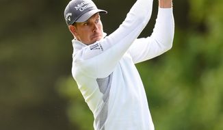 Sweden&#39;s Henrik Stenson plays a shot with an iron during day two of the BMW PGA Championship at the Wentworth Club,  Virginia Water,  England Friday May 23, 2014. (AP Photo/Adam Davy/PA) UNITED KINGDOM OUT