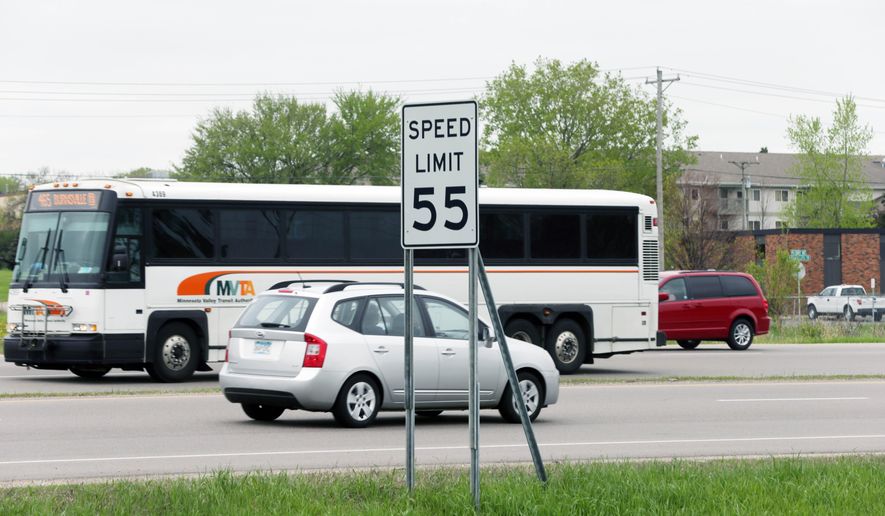 ADVANCE FOR MONDAY MAY 26 AND THEREAFTER - In this May 21, 2014 photo, a speed limit sign posts a 55 miles per hour speed limit for traffic on State Highway 13 in Burnsville, Minn. Lawmakers have urged transportation officials to boost the speed limit to 60 mph where it can "reasonably and safely" be done on two lane-two way state highways now covered by a 55 mph limit. (AP Photo/Jim Mone)