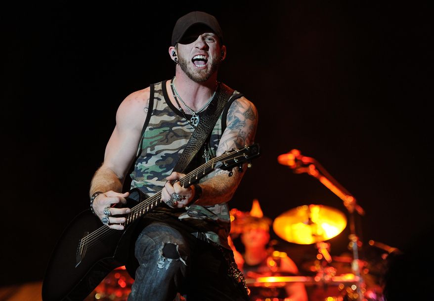 FILE - In this April 25, 2014 file photo, Brantley Gilbert performs on day one of the 2014 Stagecoach Music Festival at the Empire Polo Field in Indio, Calif. The Georgia-born singer says he is more than two years sober, but he's not giving up singing songs about drinking. (Photo by Chris Pizzello/Invision/AP, file)